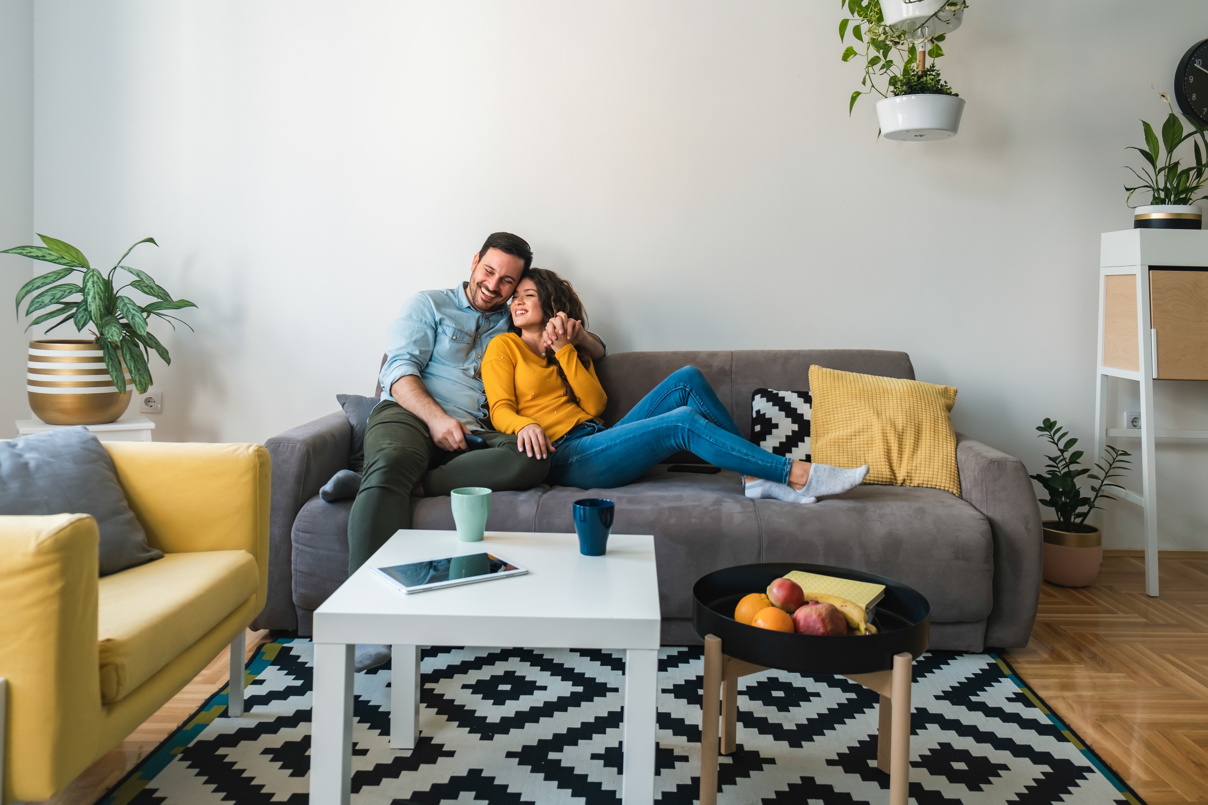 A man and woman sitting on a couch