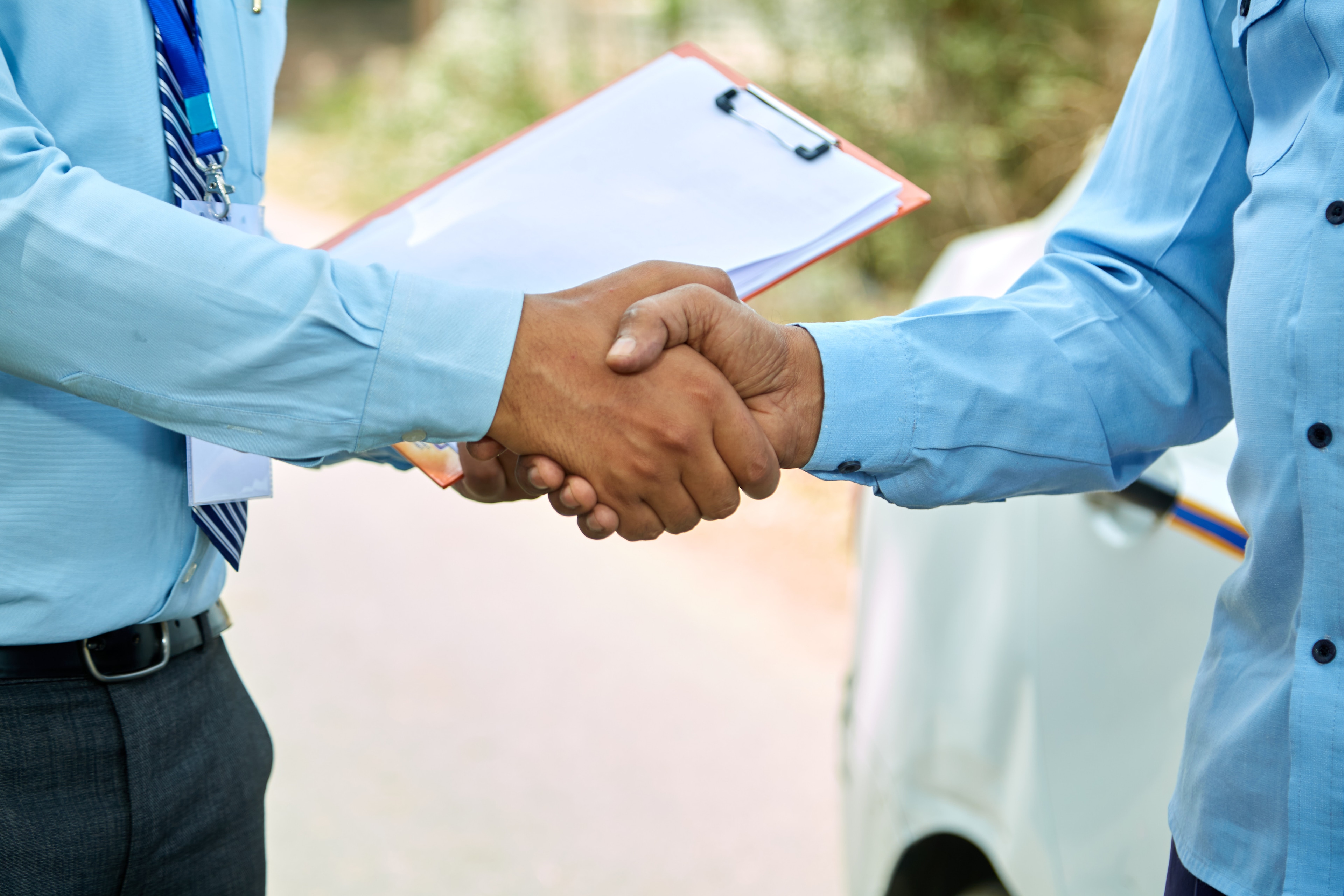 A close-up of a man shaking hands
