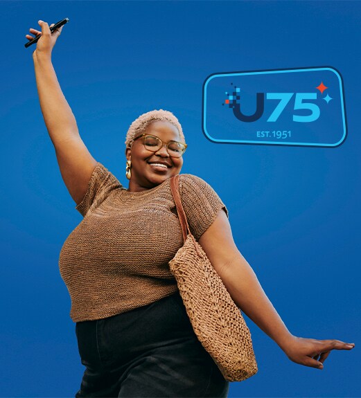 Woman smiling and striking a dance pose