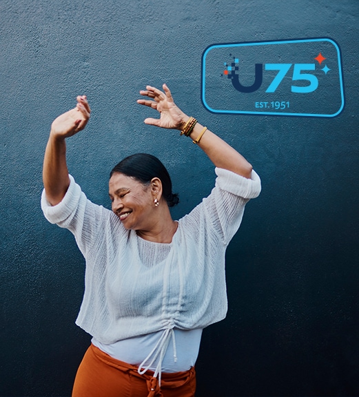 Happy woman striking a dance pose