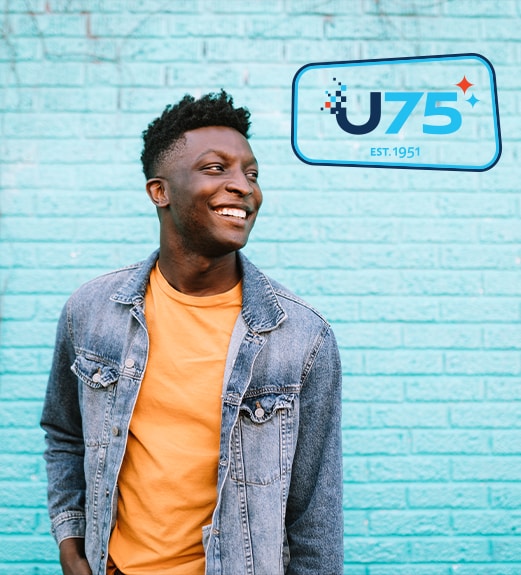 Young man looking up confidently
