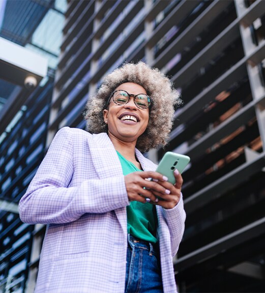 Business woman smiling outside in a city