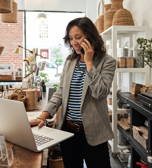 Business shop owner making a phone call