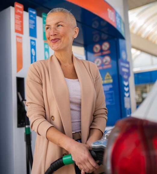 Woman filling up gas