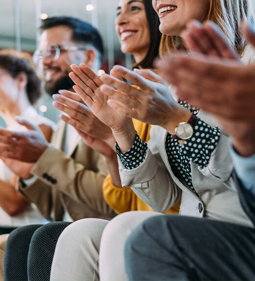 Crowd applauding accepting award