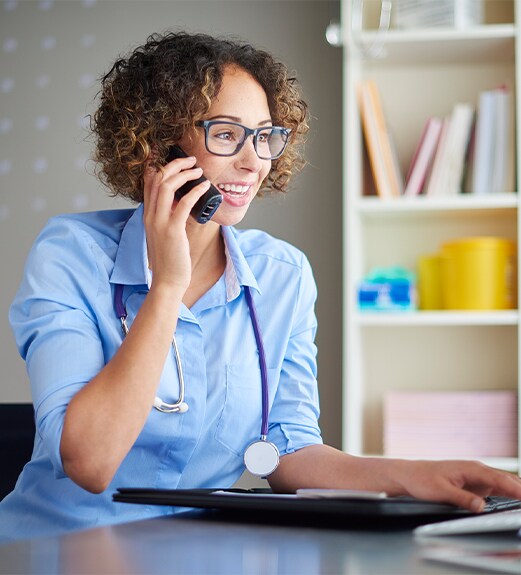 UCLA Health employee working at a desk