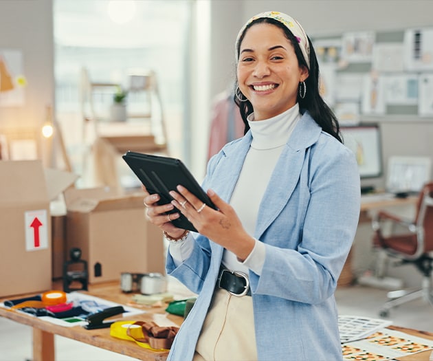 Woman checking her business account on a tablet