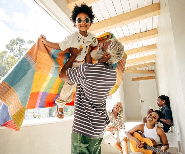 Multi-generational family enjoying tome together on a patio