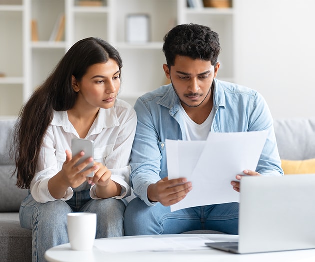Couple reviewing their finances together for a consolidation loan