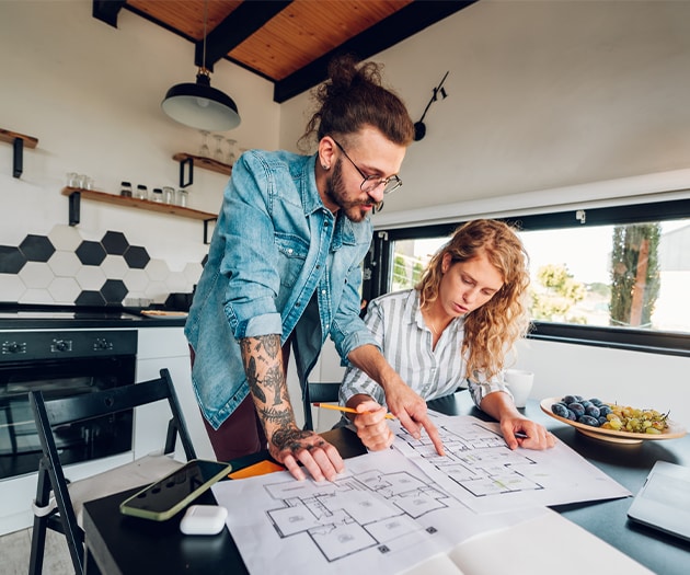 Couple reviewing plans for their HELOC home renovations