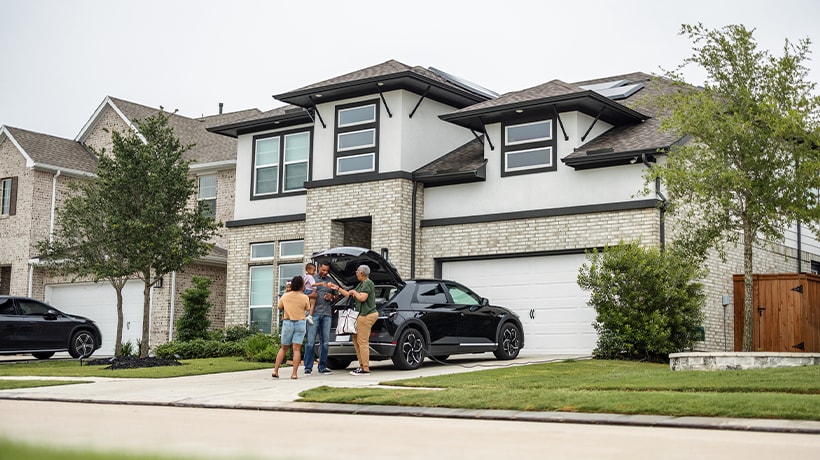 Family outside their new home
