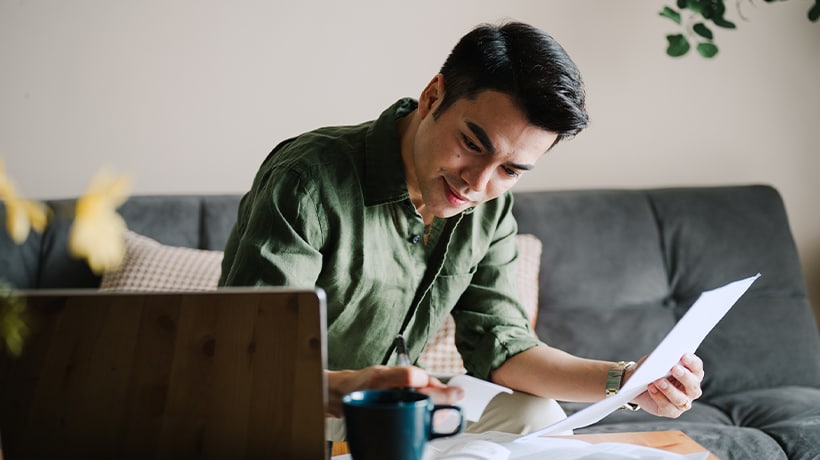 Man working at his laptop on a mortgage application