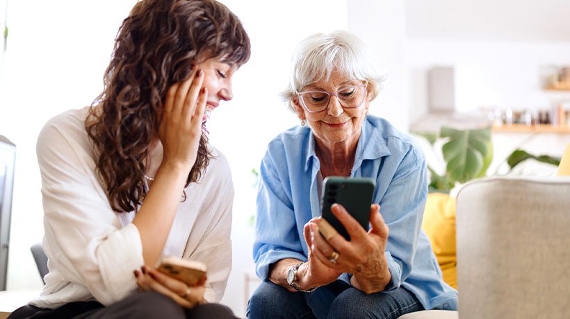 Mother and daughter checking in on security tips online