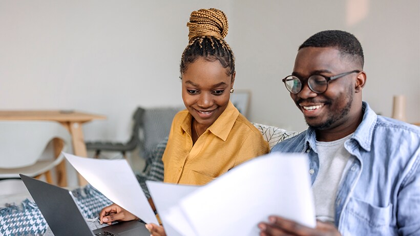 Young couple reviewing their finances for spring