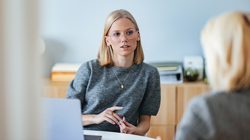 Discussing underwriting details in an office