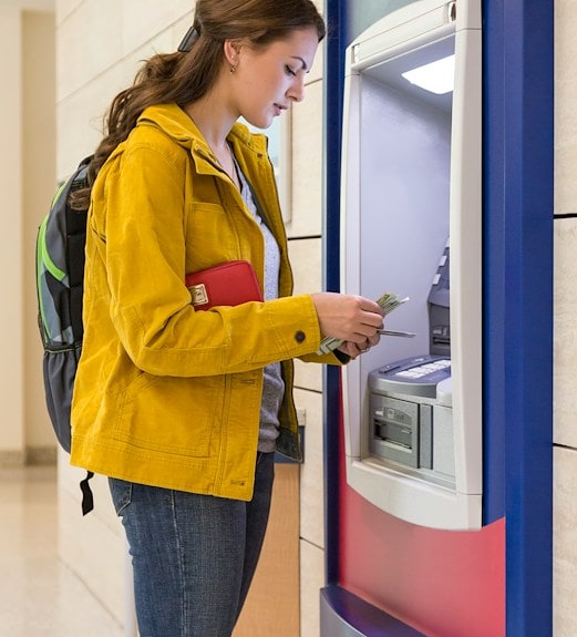Woman withdrawing cash from an ATM