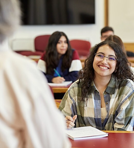 College student smiling at her professor