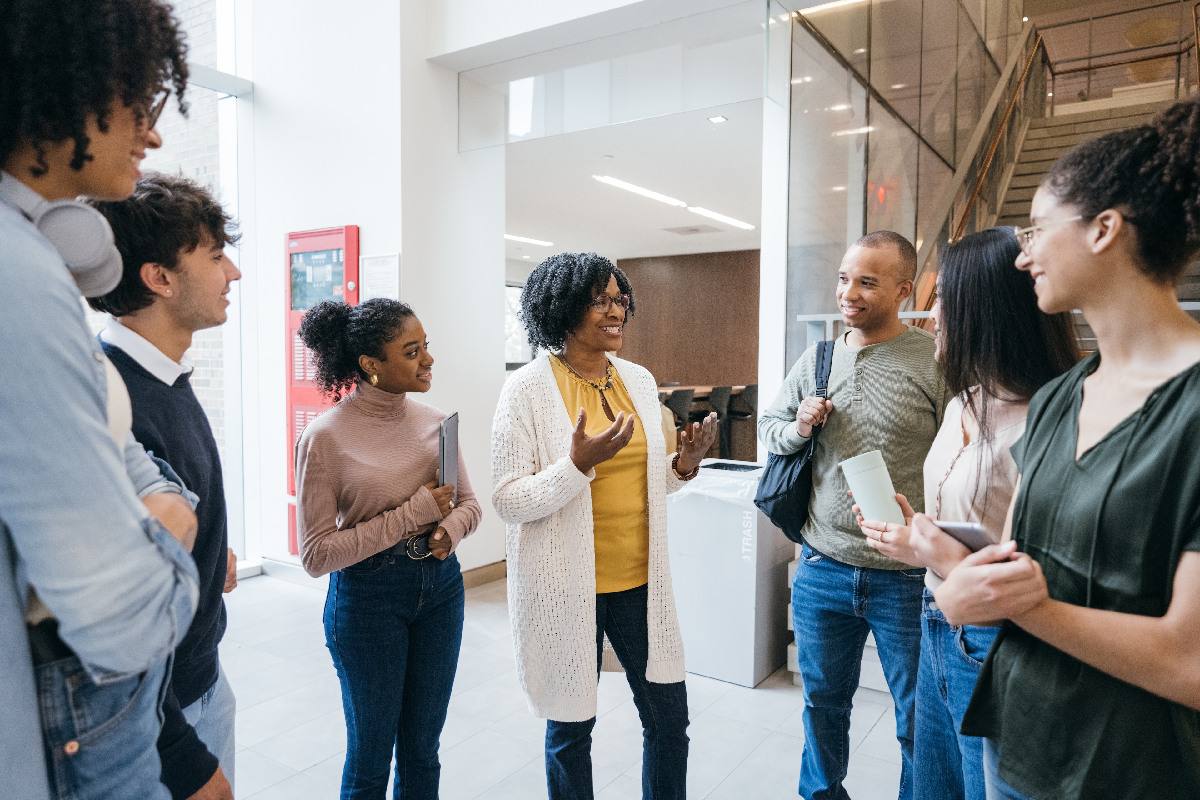 A group of people standing in a hallway