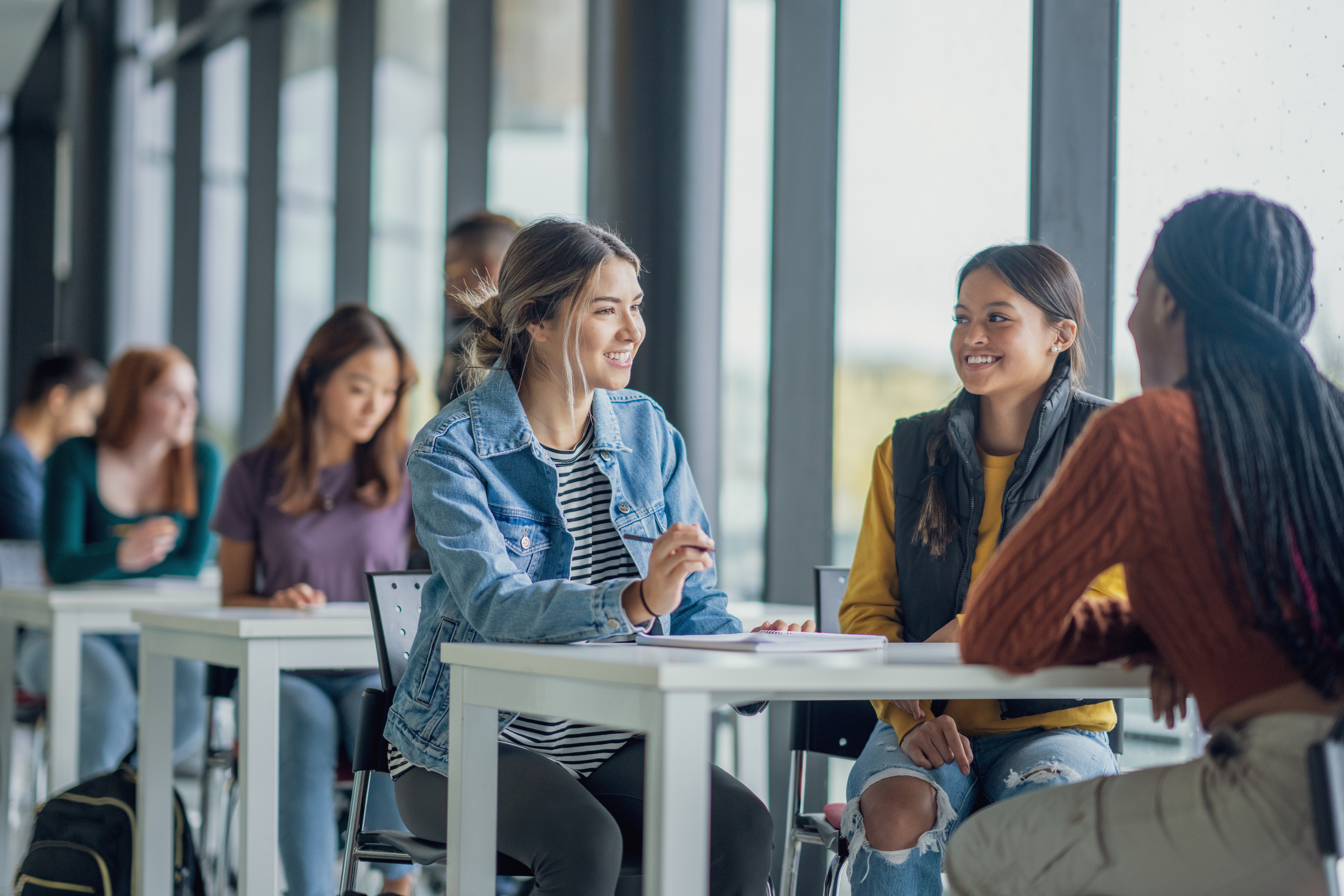 A group of people sitting at tables