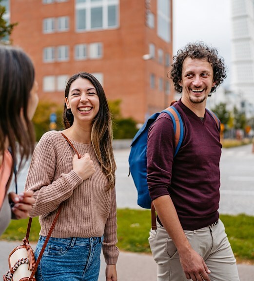 Pair of students walking around campus