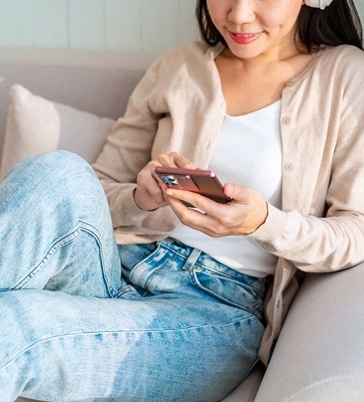 Close up view of a woman checking her digital banking account on her phone