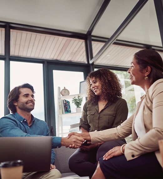 Couple meeting with their realtor at home