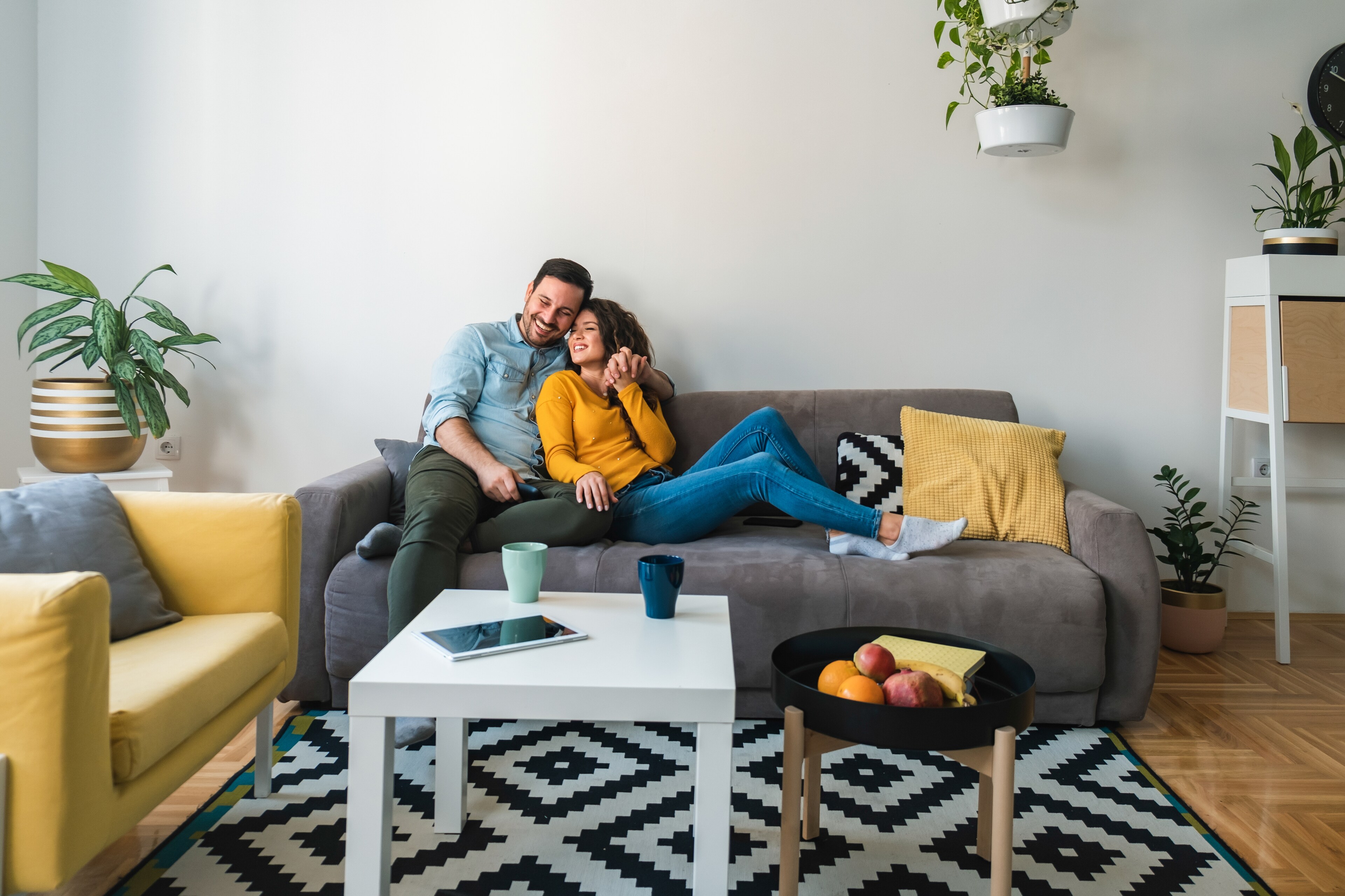 Couple exploring fixed-rate mortgages on their phone