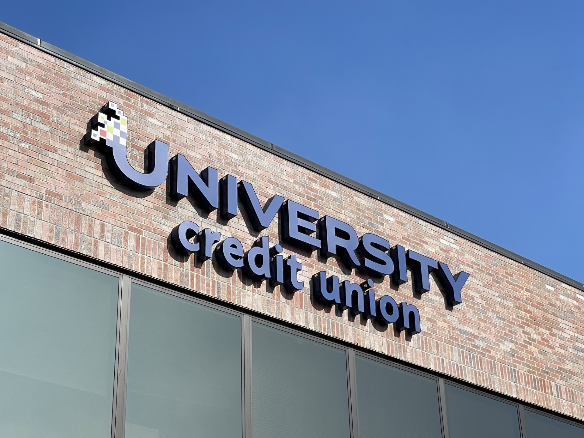 A sign on a brick building