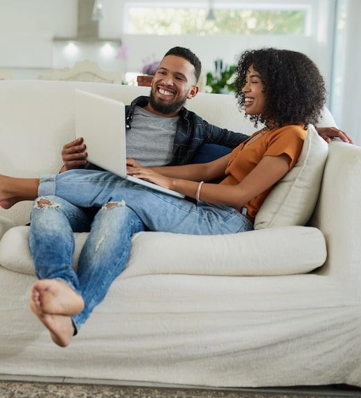 Couple checking out helpful information together on the UCU website