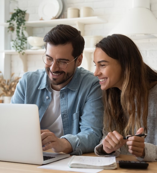 Young couple checking their application on a laptop together