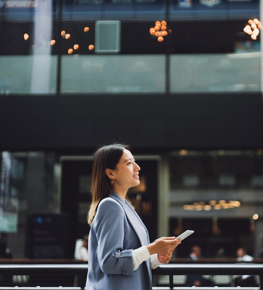 Young professional woman walking forward confidently
