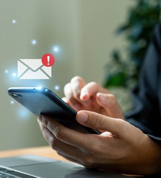 Close up view of a hand holing a mobile phone receiving a message