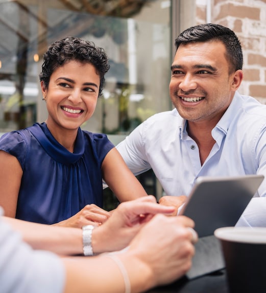 Confident couple discussing the security of their account with a representative