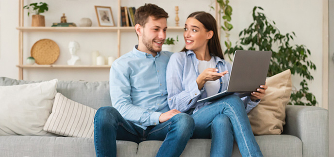 Couple planning out their loan options online