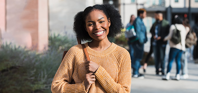 Smiling young college student on campus