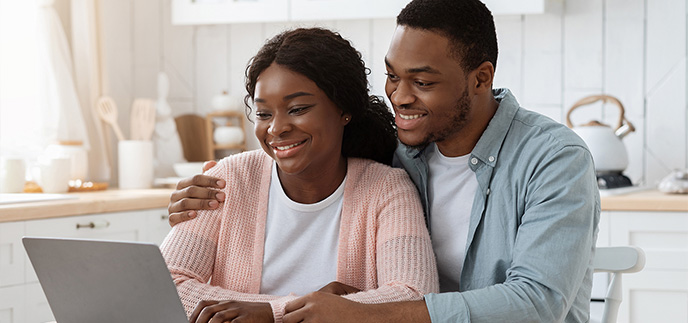 Couple planning their HELOC options together online